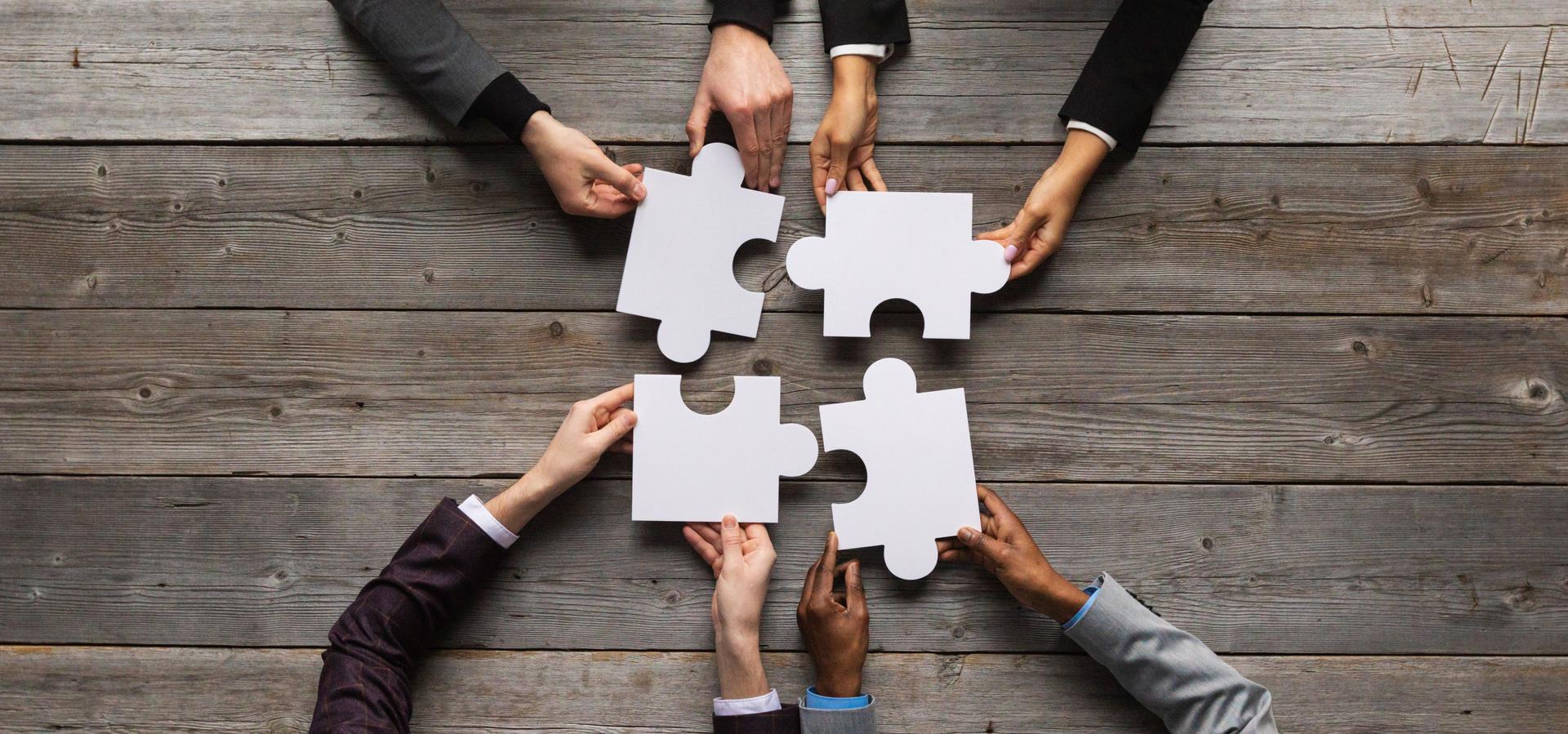 Business teamwork with puzzle